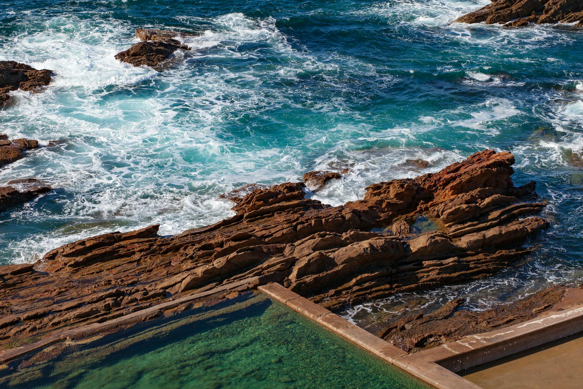 Exploring colourful rock pools on a Cornwall beach at low tide