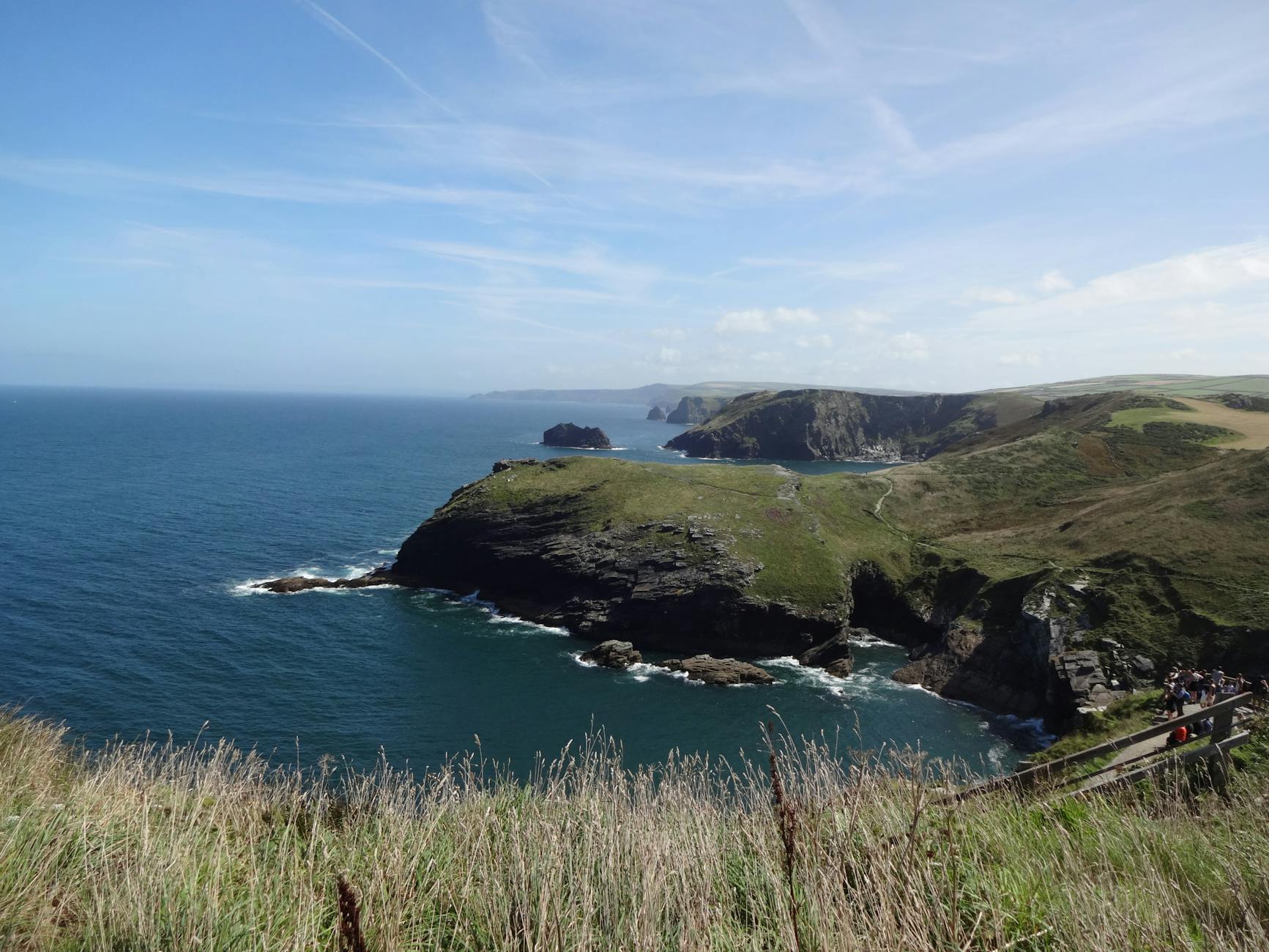 Walking Cornwall coastal path with dramatic cliff views over the Atlantic Ocean
