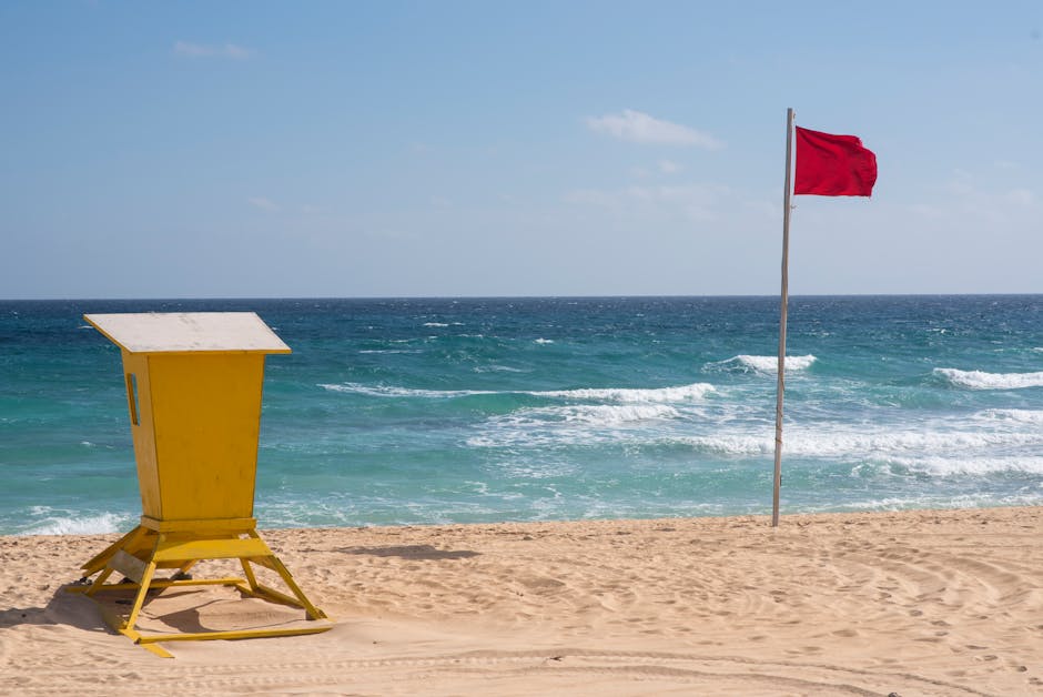 Beach lifeguard station with red flag warning