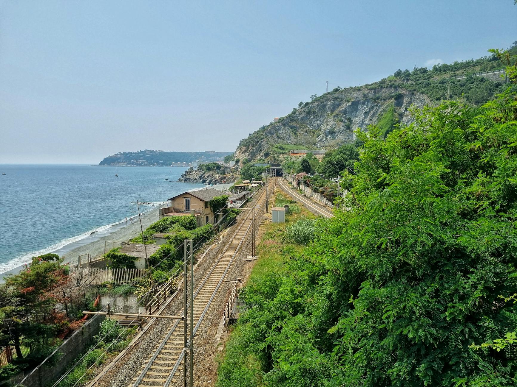 Coastal railway train travelling toward Cornwall beside the sea