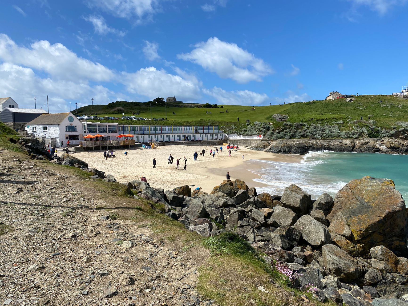 Wide sandy beach and turquoise water of St Ives Bay on the eastern coast walk