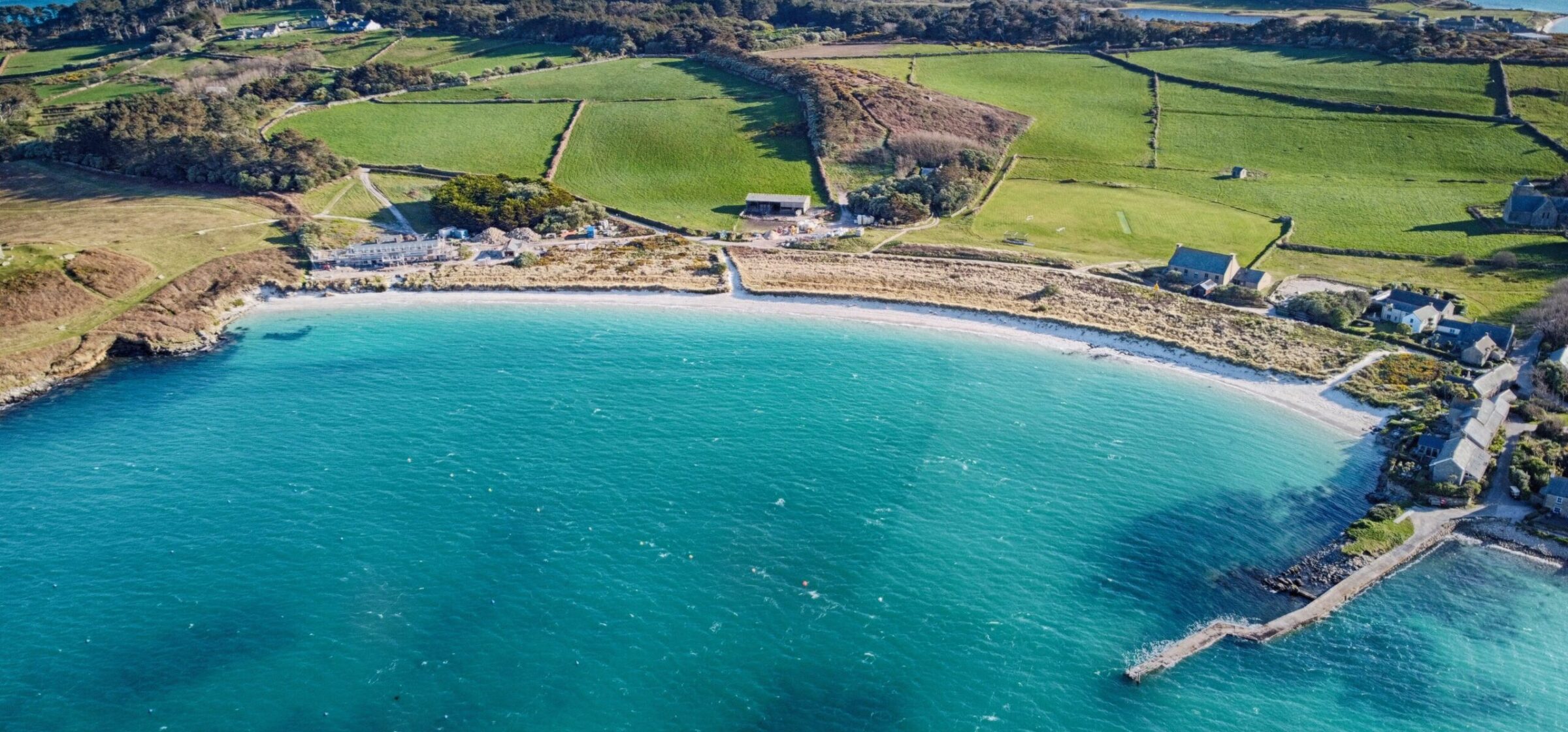 Turquoise water and pale sand at Old Grimsby beach on Tresco, Isles of Scilly