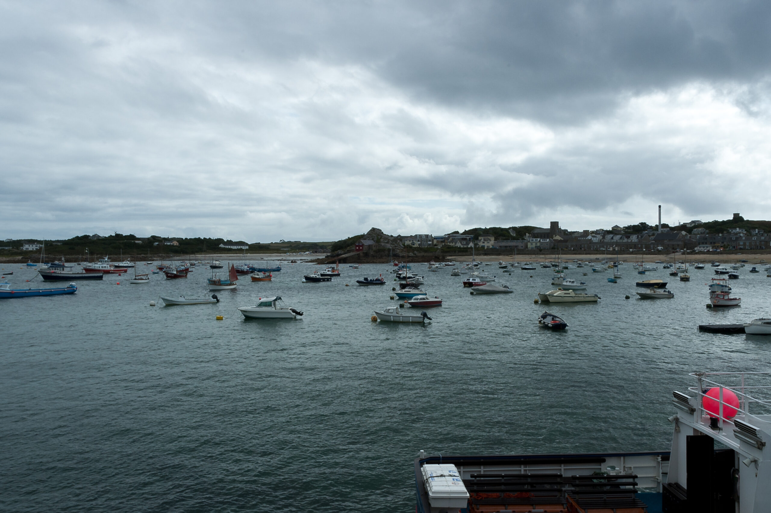 Boats moored in St Mary's Pool with Hugh Town behind, Isles of Scilly
